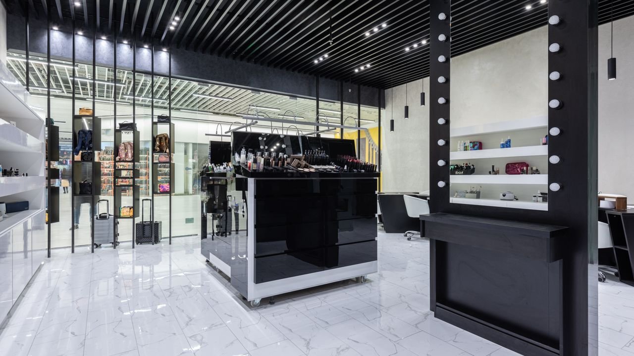 Sleek modern interior of a beauty store with cosmetics and chic decor.