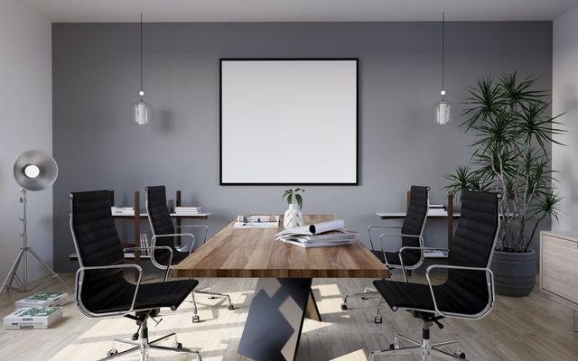 Sleek and modern conference room with minimalist design featuring stylish furniture and indoor plants.