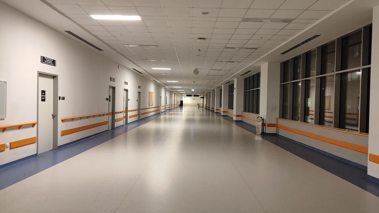 Wide corridor view in a modern hospital, Ankara, Türkiye. Well-lit and clean interior.