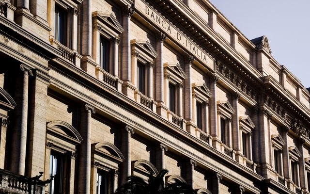 Sunlit facade of the iconic Banca d'Italia in Rome, showcasing classic architecture.