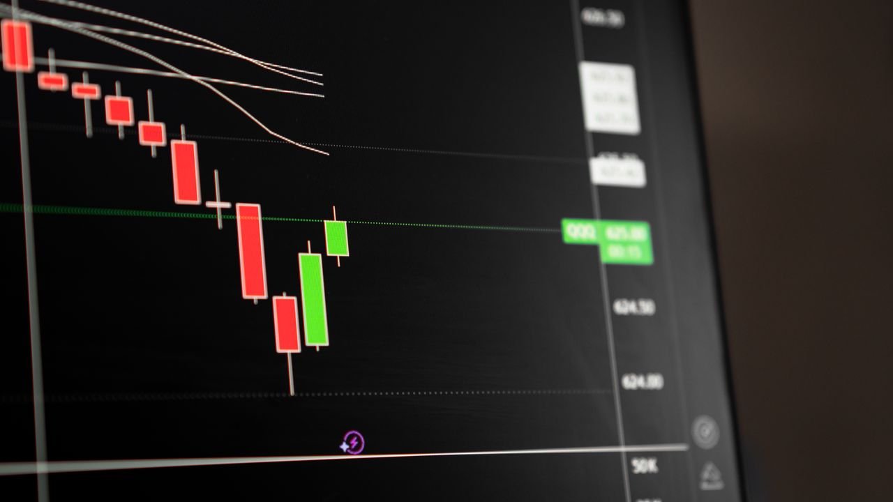 Candlestick chart showing a downward trend in the stock market analysis.