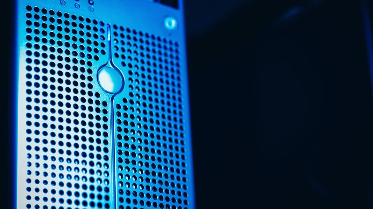 Modern server rack with blue lighting in a secure data center environment.