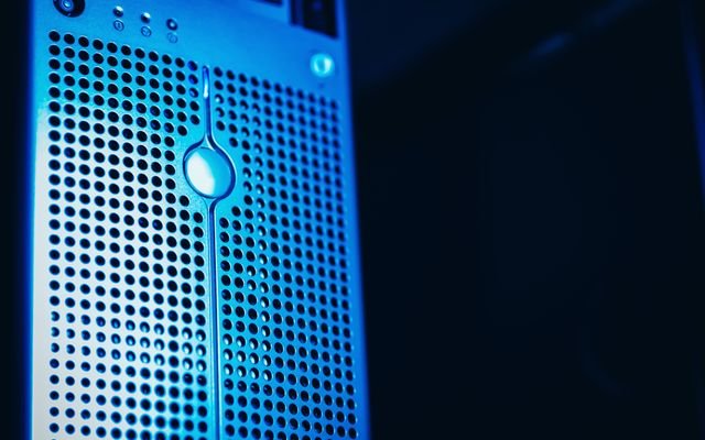 Modern server rack with blue lighting in a secure data center environment.