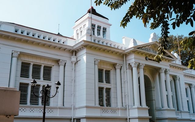 A historic colonial-style building in Bandung, featuring classic columns and intricate details.