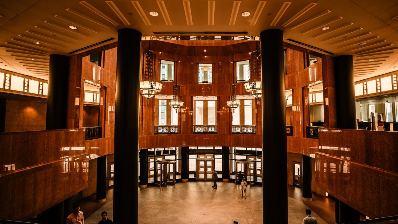 Grand interior view of a Minneapolis office building featuring modern architecture and warm lighting.