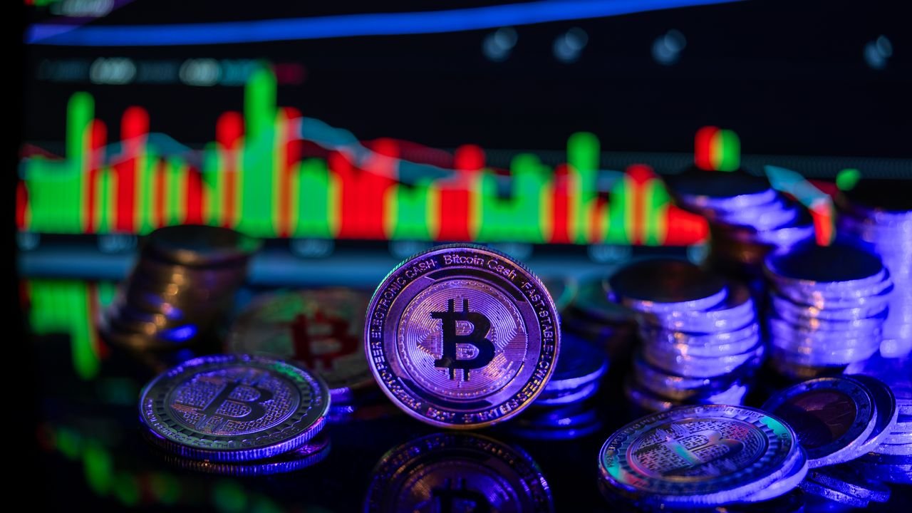 Colorful chart with Bitcoin coins reflecting cryptocurrency market trends and volatility.