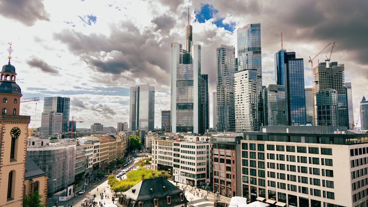 A stunning aerial view of Frankfurt's skyscrapers under dramatic skies. Perfect for business and travel enthusiasts.