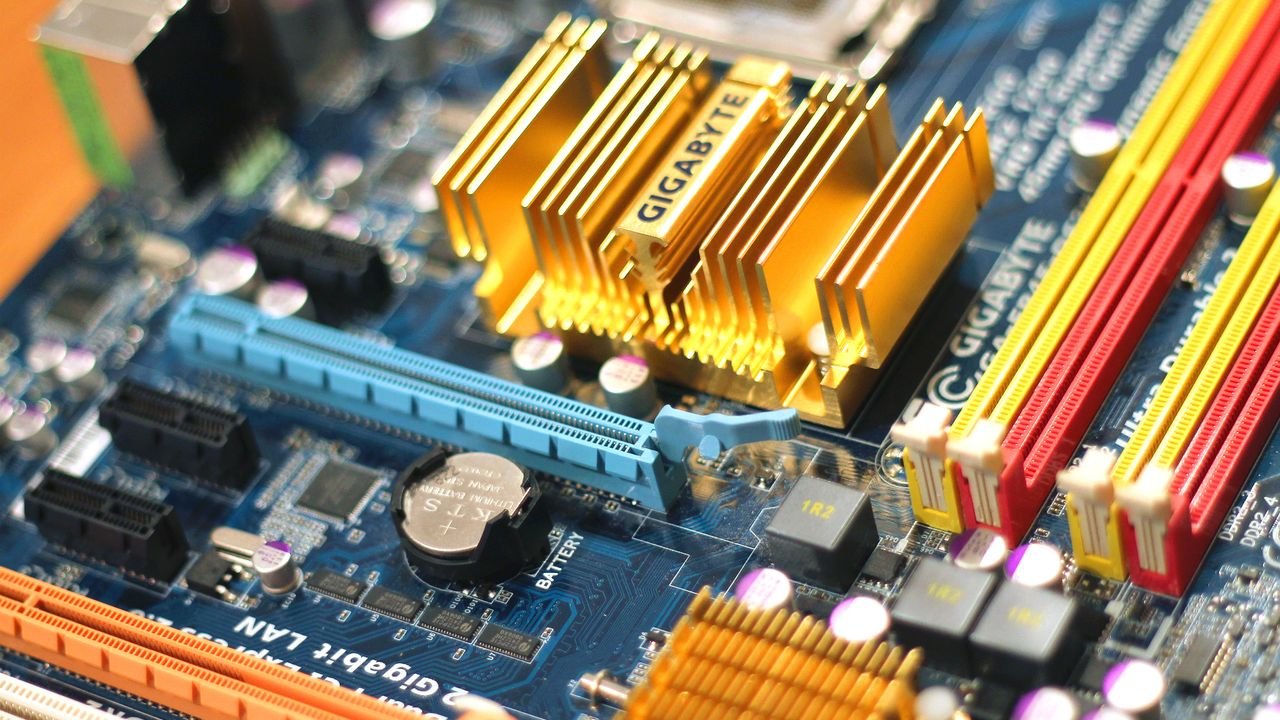 Detailed close-up of a computer motherboard showcasing various electronic components.