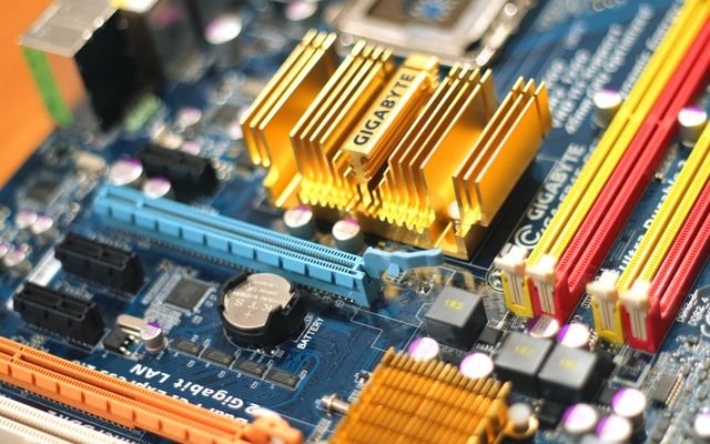 Detailed close-up of a computer motherboard showcasing various electronic components.