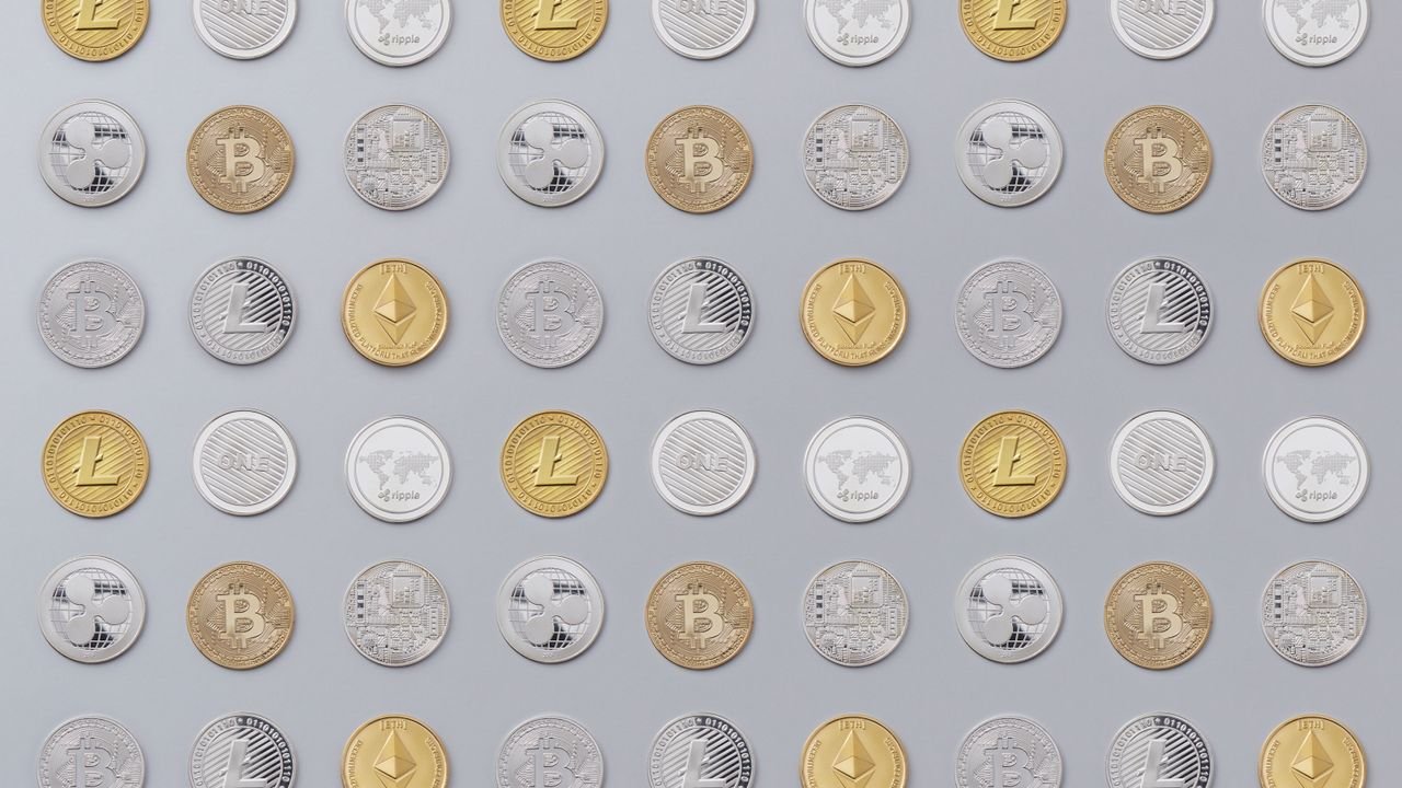 A seamless pattern of various cryptocurrency coins in gold and silver tones.