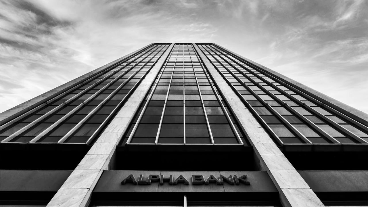 A striking black and white photo of a high-rise building in Athens, Greece.
