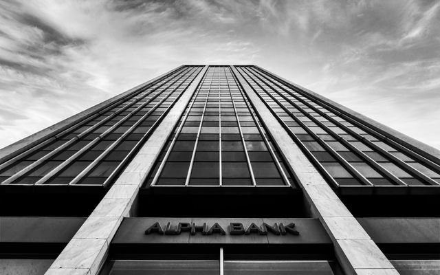 A striking black and white photo of a high-rise building in Athens, Greece.
